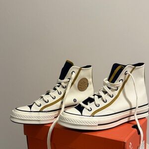 Converse High-Top Sneakers in White and Black with Gold Accents